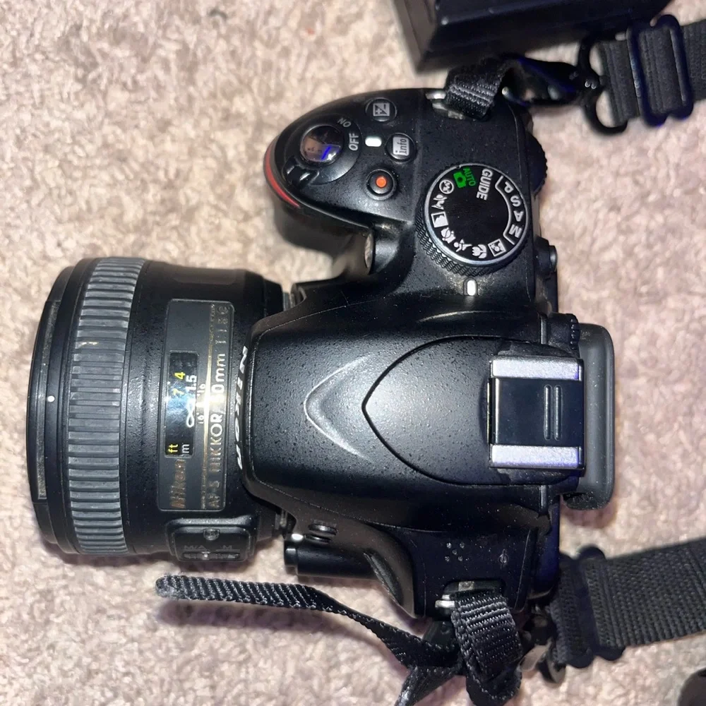 Nikon D3200 Camera. Includes Battery, 3 Nikon Lenses, Battery Charger, and Case.